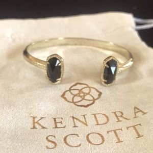 Kendra Scott Elton bracelet in gold with black opaque glass stone.